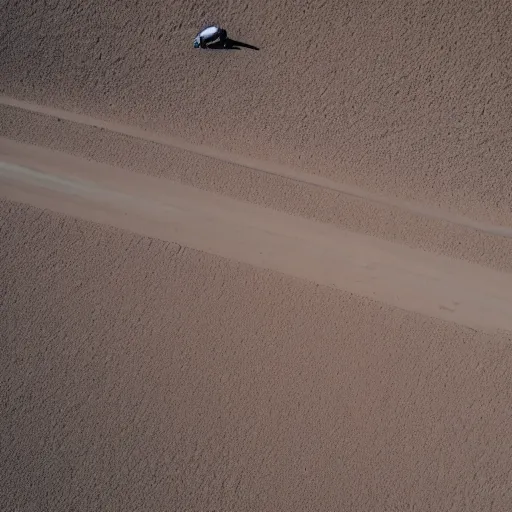 Prompt: satellite view of a man running on an abandoned road in a desert