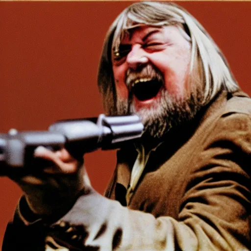 Prompt: laughing robert wyatt pointing a gun at the camera