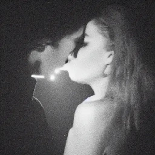 Image similar to a night - vision photo of prince kissing a woman in low light. it's so dark, you can barely make out their features.