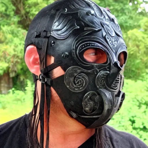 Image similar to an ancient warrior in black wearing a metal face mask