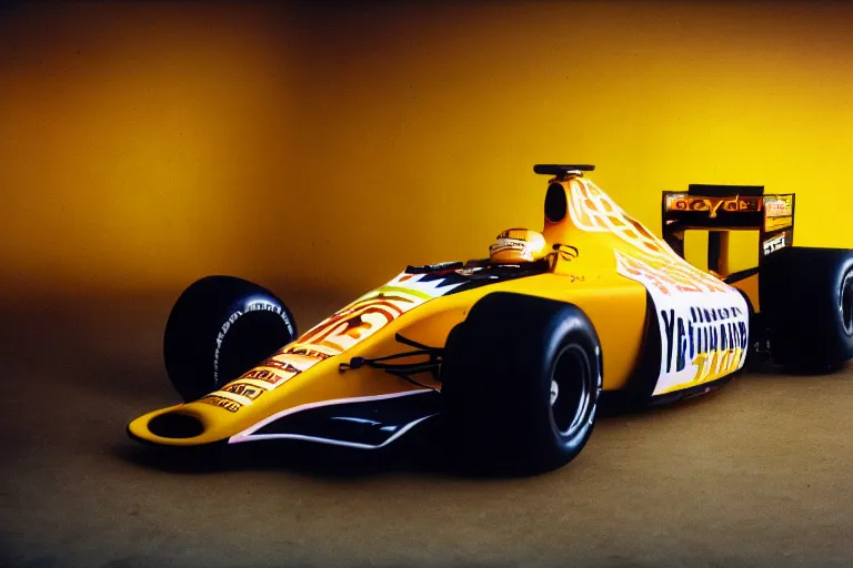 Image similar to a photograph of a formula one car sponsored by a banana company, wide angle lens, fujifilm, 24mm, fuji velvia, dramatic lighting