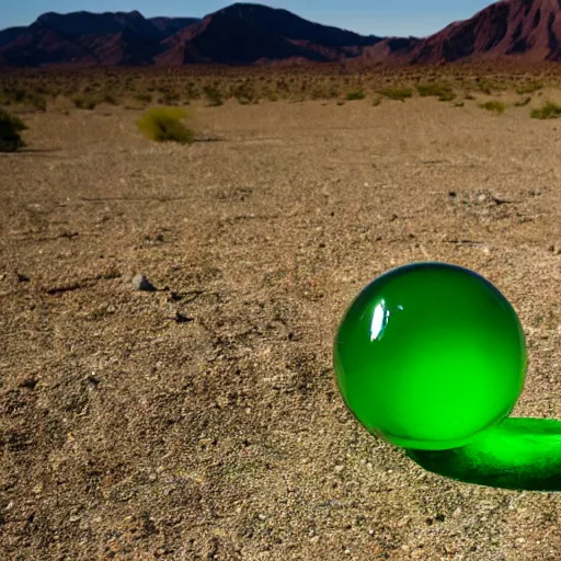 Prompt: green glass ball in the desert