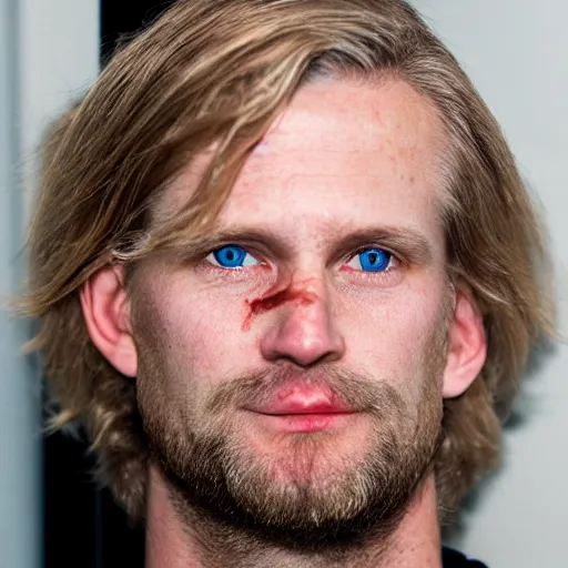 Image similar to full face color photograph of a 40 year old very handsome white man with very short, wavy, light blond hair and small blue eyes, dressed in a maroon t shirt and black jeans, with very thin lips, with a straight nose and blond stubble on his oval face, and pale skin. He resembles a lion.