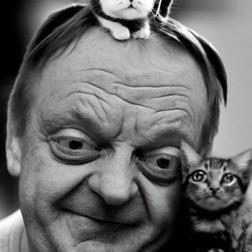 Image similar to laughing mark e smith with a cute kitty on his head