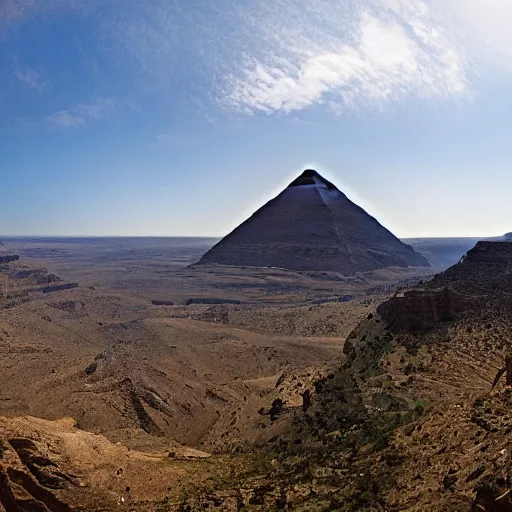 Image similar to faraway shot of a pyramid from a canyon, panoramic