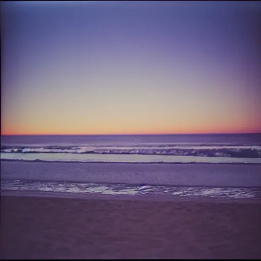 Prompt: california beach sunset on expired film, shot with an analog camera, muted colours, looking out at the ocean, photography