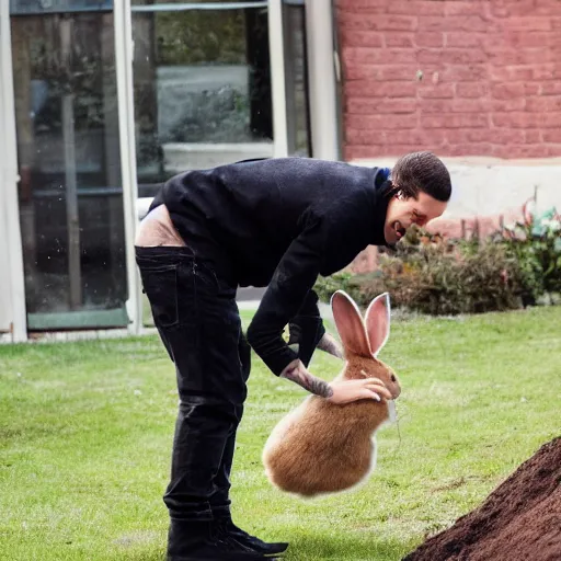 Image similar to pete davidson gleefully pulling a rabbit out of a hole