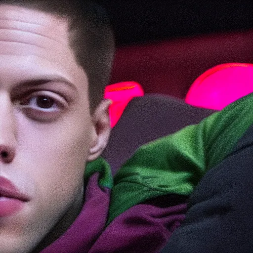 Image similar to pete davidson watching movies in the dark wearing neon clothes