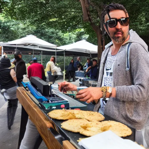 Prompt: in the park, a disc jockey playing music from turntables and eating a falafel pita sandwich