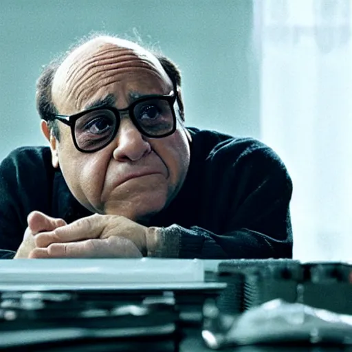 Image similar to danny devito bleary eyed at a computer, film still from the movie directed by Denis Villeneuve