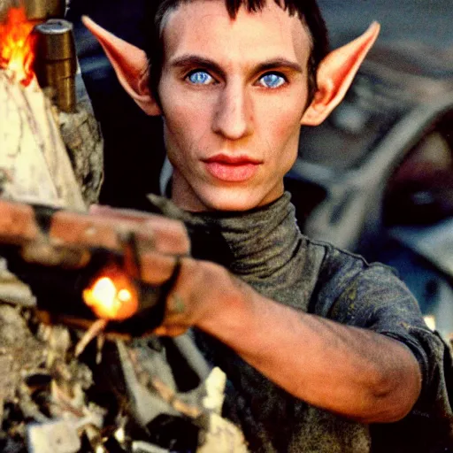 Image similar to close up headshot of a skinny high-fantasy elf with a long narrow face and spiky blonde hair wearing dark brown overalls and holding a bomb next to a destroyed car, high resolution film still, fim by Peter Jackson