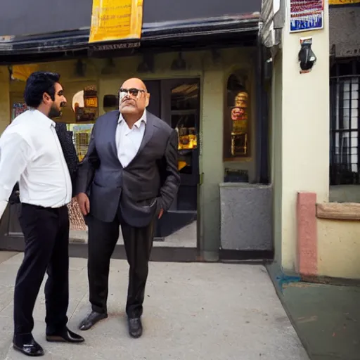 Image similar to portrait of tall indian man in a suit arguing with danny devito outside a bar, photo