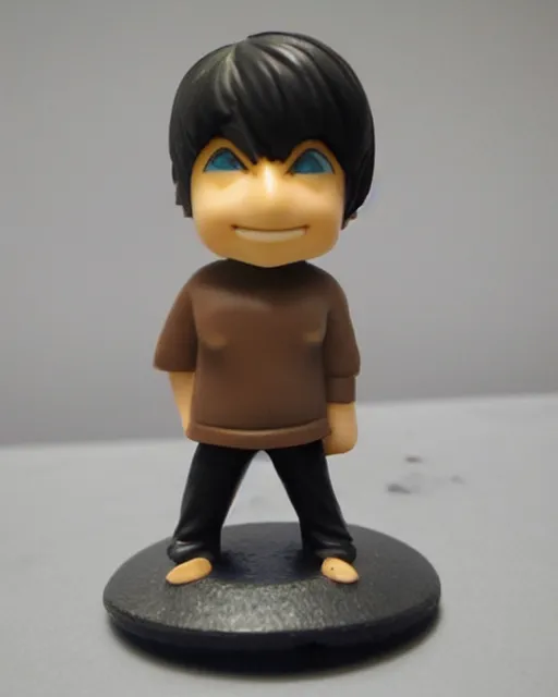 Image similar to a cute little plastic chibi statuette of jerma 9 8 5 on computer, ebay listing, product picture, advertisement, thumbnail