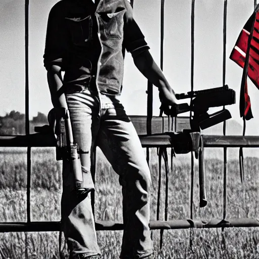 Image similar to Young man standing looking to the right in a red bandana, blue striped shirt, gray vest and a gun with a partly cloudy sky in the background. The young man is standing in front of an iron fence. Photograph. Real life