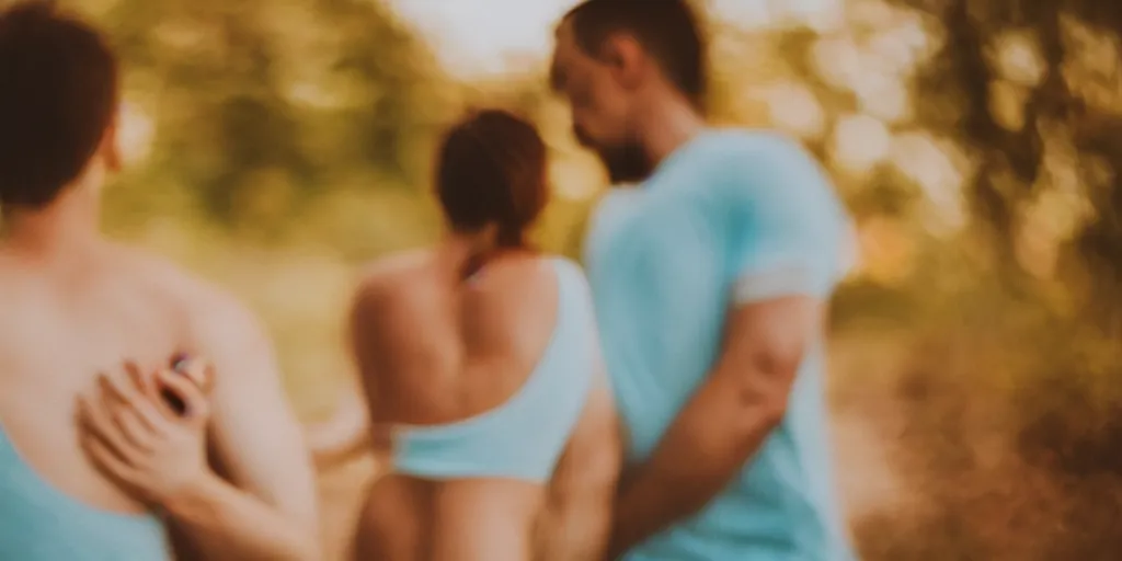 Image similar to a blurry picture of gorgeous human bodies intertwined, long exposure photograph, anamorphic bokeh, orange and cyan lighting, cinematic