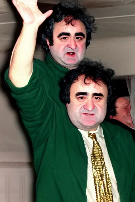 Image similar to gordon brown mixed with john belushi, dark black hair, wearing a green umbro tracksuit and gold necklace star shaped medallion, hands raised in the air,