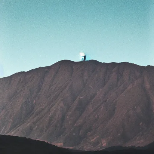 Image similar to a black dot in the sky above a hilly mountain, landscape