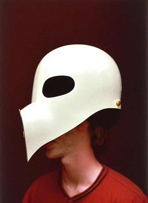 Prompt: realistic photo of a freestanding white face helmet with pattern of white eyes, brass long nose, black latex chin, ears made of white hairy long sticks ; 1 9 9 0, life magazine reportage photo, natural colors, kodak ektar, 2 0 0 iso, 3 5 mm lens, bill henson