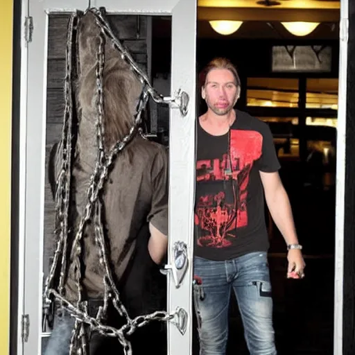 Image similar to chad robert kroeger of nickelback tied up with chains to the front door of an applebee's