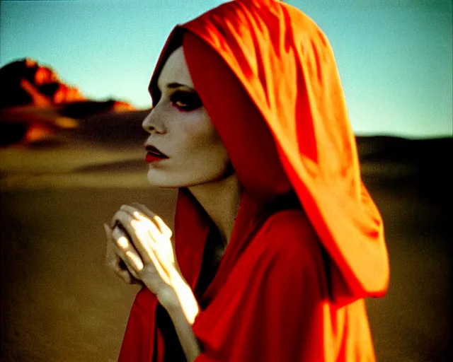 Image similar to by bruce davidson, by andrew boog faithfull redscale photography evocative. a mystical woman in scarlet robes, conical hot in front of a desert mesa.