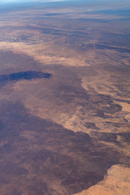 Prompt: airplane window view, flying above a drying landscape and huge fire