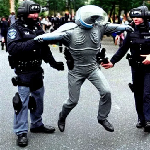 Prompt: an extraterrestrial grey xfiles alien reticulan being arrested by spetsnaz