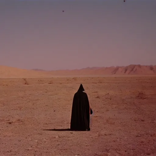 Image similar to a man wearing a long cloak and gasmask, in the desert, film still, arriflex 35