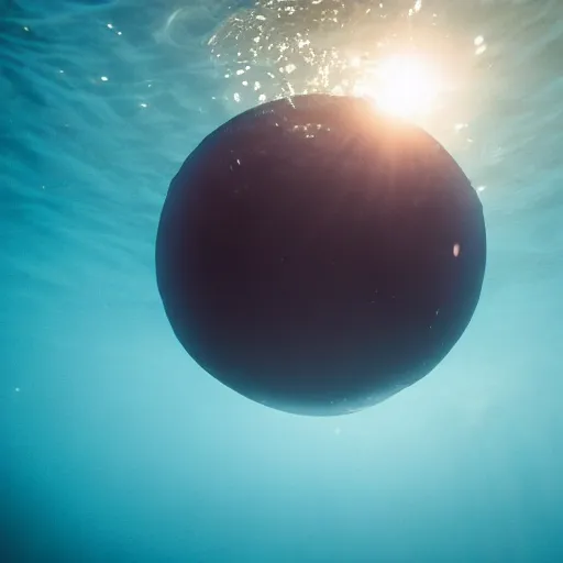 Prompt: sphere shaped object glowing under water