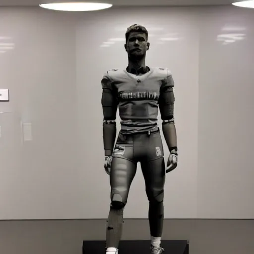 Image similar to a realistic detailed photo of a guy who is an attractive humanoid who is half robot and half humanoid, who is a male android, football player christian mccaffrey, shiny skin, posing like a statue, blank stare, at the museum, on display