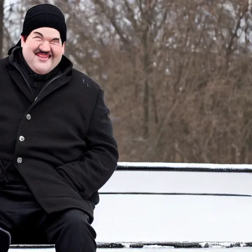 Image similar to Kevin Malone wearing a black beanie hat and black wool overcoat sitting on a park bench during the winter