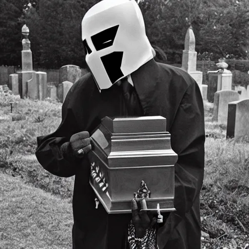 Image similar to MF DOOM standing in a graveyard with a dug up coffin