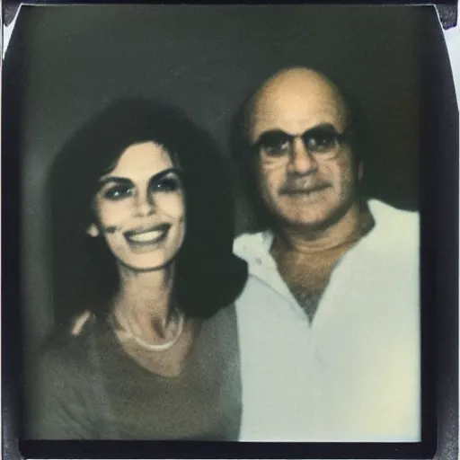 Image similar to found faded 1978 polaroid picture of my parents who look just like Danny Devito and Cindy Crawford