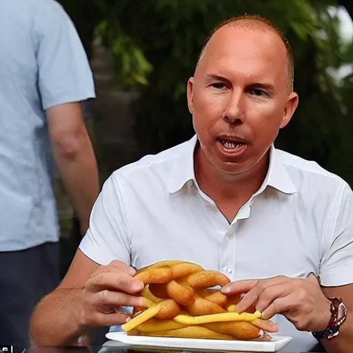 Image similar to peter dutton has revealed he was bombarded with text messages after he was pictured awkwardly eating a dagwood dog at a carnival