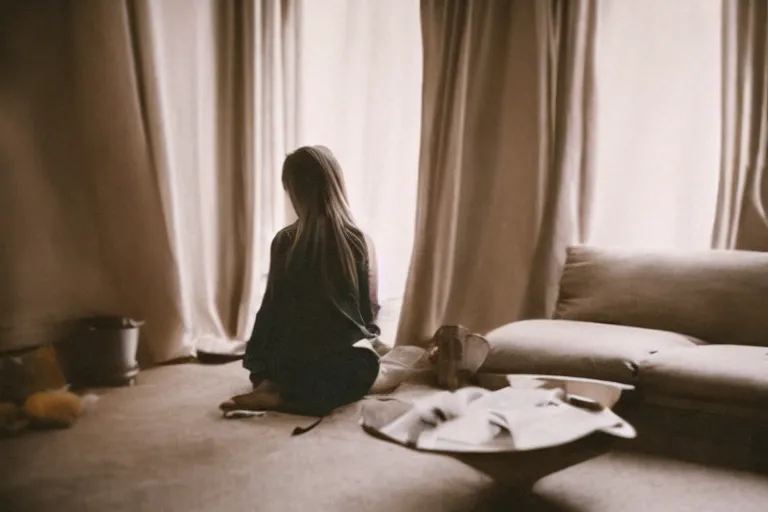 Image similar to film photography of the light shining on girl in living room interior, soft light, no focus