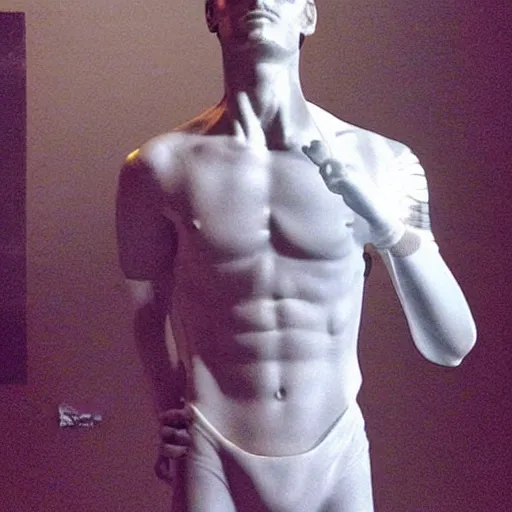 Image similar to “ a realistic detailed photo of a guy who is an attractive humanoid who is half robot and half humanoid, who is a male android, soccer player antoine griezmann, shiny skin, posing like a statue, blank stare, at the museum, on display ”