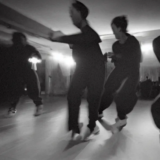 Prompt: photograph of a group of people in baggy outfits and bulky shoes dancing in a dark room, taken from a distance to show showing the whole bodies, smudged grainy blurry gritty, dynamic frenetic, taken with a soviet flash camera at slow shutter speed