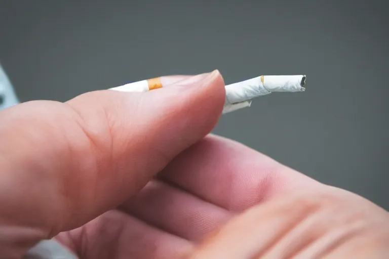 Image similar to cigarette in fingers, hand holding cigarette, hyper realistic, natural