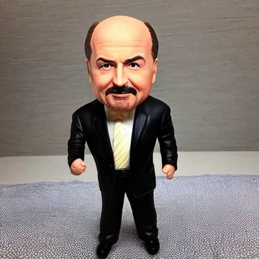 Prompt: dr. phil bobblehead toy