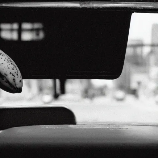 Prompt: movie still of a lone banana on the front seat of a taxi cab, cinematic Eastman 5384 film