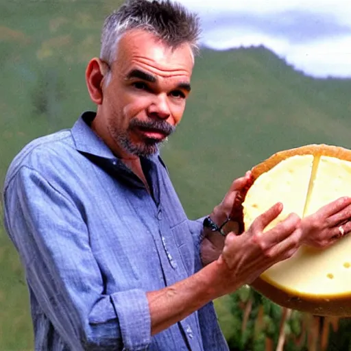 Image similar to billy bob thornton eating a large wheel of cheese,