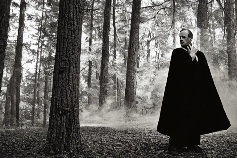 Image similar to vintage kodak film photography from 7 0 s with pro mist filter, close - up man in black robe portrait, forest, in style of joel meyerowitz