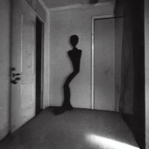 Image similar to a cursed creepy Photograph of an old black room with a crying mannequin and a ghost, dust in the air, brown wood cabinets, SCP, taken using a film camera with 35mm expired film, bright camera flash enabled, award winning photograph, sleep paralysis demon crabwalking towards camera, creepy, liminal space, in the style of the movie Pulse