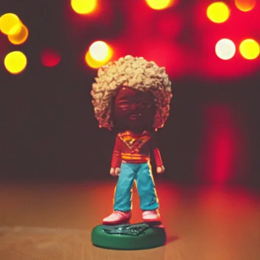 Prompt: close up of photo of Jimmy Hendrix bobble head on table top with fairy lights in the background, expired film, thin dof, soft lighting, realistic, swirly bokeh