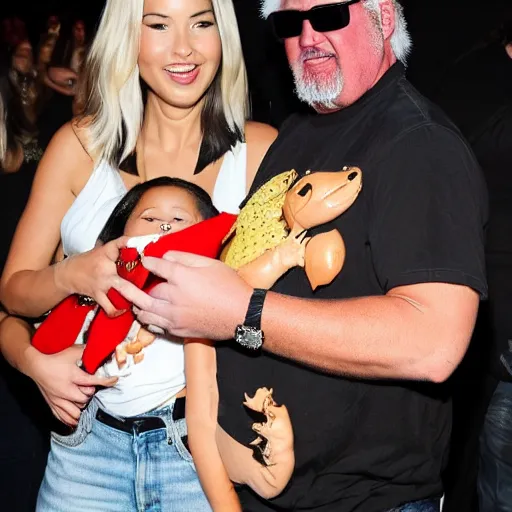 Image similar to olivia munn and guy fieri holding their baby