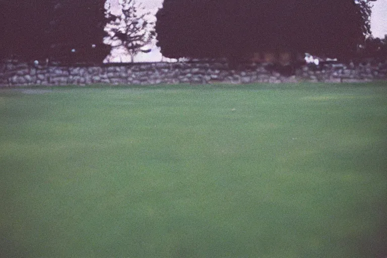 Image similar to film color photography, long view of small square mirror lies at the green lawn, no focus, 35mm