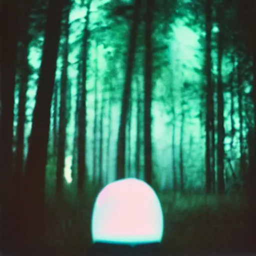 Image similar to a ufo with glowing lights flying over a forest at night, old polaroid, expired film,