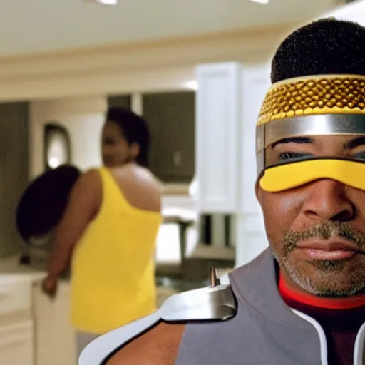 Image similar to Geordi La Forge wearing visor and a colander and random kitchen tools on his head