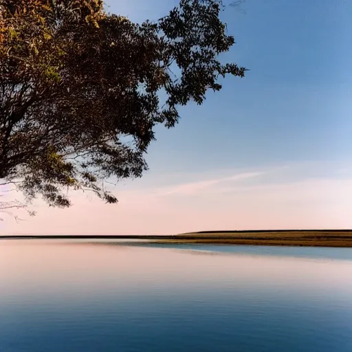 Image similar to a still plain of endless water across the horizon, no waves, no ripples, with a blue sky above it and reflected within it