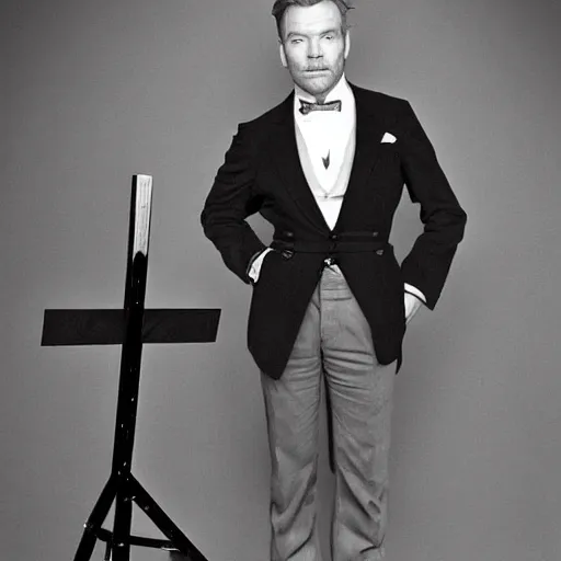 Image similar to ewan mcgregor is dressed as a gentleman at early 2 0 th century paris. he is standing next to an easel. that easel has a canvas on it.