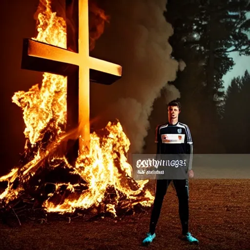 Prompt: robert lewandowski in front of a burning christian cross, night, forest, dark, black